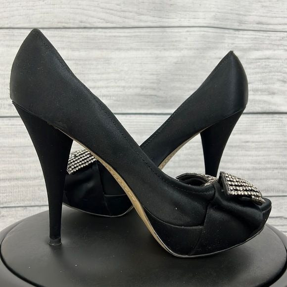 Black silk rhinestone bow pumps